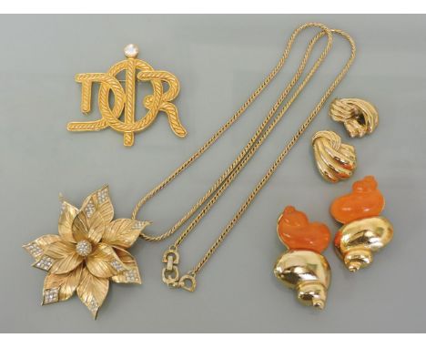 A Christian Dior gold plated poinsettia pendant, pavé set with paste, suspended on a snake chain, together with a 'Dior' C/D 