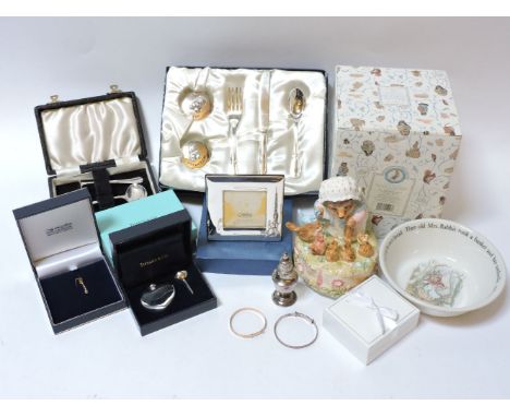 A Tiffany & Co spirit flask, silver christening bracelet, photo frame, Peter Rabbit china, and a small gold bangle