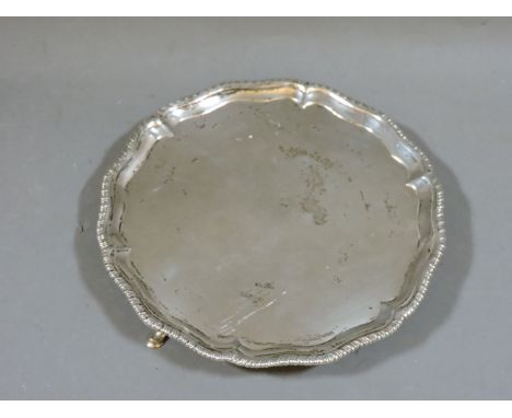 A George III silver waiter, with gadrooned edge and standing on short hoof feet, marks for London 1771, maker's mark of R R p