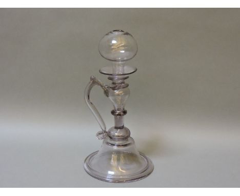 A Continental glass lace maker's lamp, 26cm high