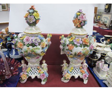 A Pair of Dresden Mid to Late XX Century Ceramic Urn Vases, each with hand painted Regency courting scene, heavily encrusted 