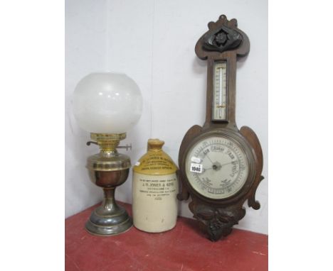 A Carved Oak Wall Barometer, circa 1900, approximately 62cm high, oil lamp, Pearson's stoneware flagon, for J.H. Jones (3).