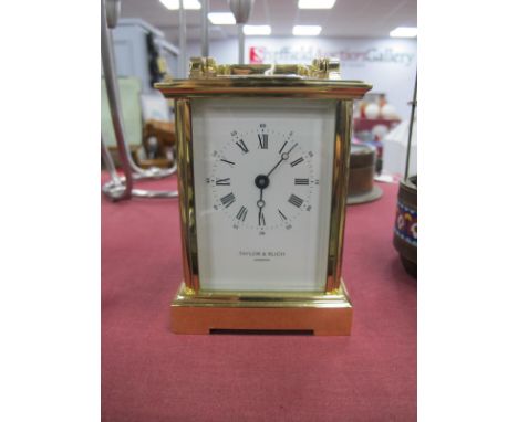 A Carriage Clock for Taylor and Bligh, London, 11.5cm high with handle down.