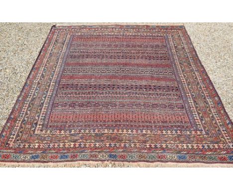 A vintage Moroccan geometric design Sumak weave carpet, multi-coloured bands within conforming borders, 300 cm x 198 cm 