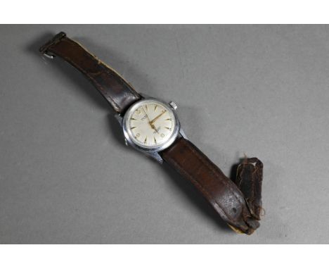 A vintage gents Olma wristwatch, the champagne dial with gilt markers and hands within a 32 mm steel case - a/ftarnished as w