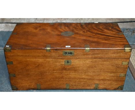 A Victorian brass bound camphorwood campaign trunk, with folding carrying handles to sides, the interior retaining makers lab