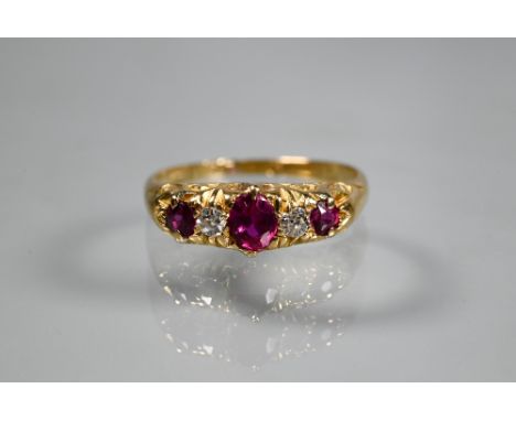 An antique five stone ruby and diamond ring, the graduated stones in 18ct yellow gold setting, size M 1/2 