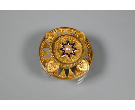 A Victorian gold roundel brooch in the neo-classical manner, the central blue enamel star with half pearl to middle, with wir