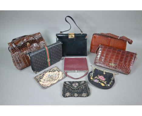 A collection of nine various vintage handbags including Mappin &amp; Webb retailed lizard style, black leather Ackery handbag