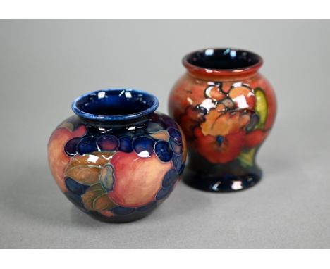 A vintage Moorcroft small baluster vase, decorated with 'orchid' pattern on flambé ground, 8 cm to/w a small bulbous vase wit