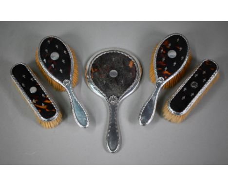 A silver and tortoiseshell picquet-work five-piece brush set including hand-mirror, Levi & Salaman, Birmingham 1909/10 dent i