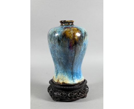 A Chinese Junyao style meiping vase, the exterior covered in a thick striated opaque blue glaze with large irregular purple a