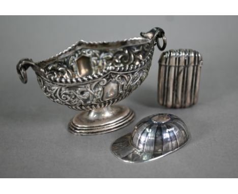 A Victorian silver stemmed oval salt, richly embossed and chased with scrolling foliage, Chester 1896, to/w a vesta case of r