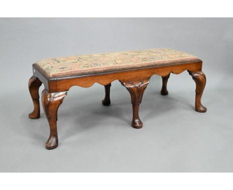 A Georgian style walnut framed six legged long stool with drop in tapestry seat, early 20th century, 104 cm x 44 cm x 37 cm h