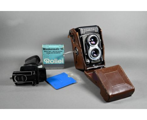 A Rolleiflex twin-lens reflex camera with Synchro-Compur lens, in leather case with trigger-handle, boxed Mark-Set 16 and Par