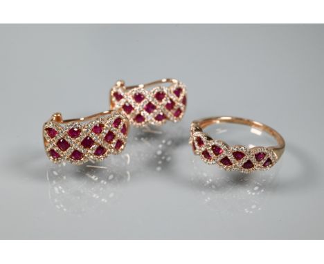 A ring and earring suite stamped 'Royal', with ruby and diamond lattice-work design, rose metal set stamped 14k, the ring siz