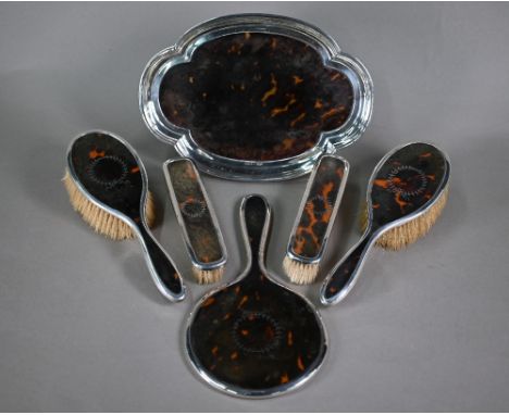 A silver and piqué-work tortoiseshell five-piece brush set including hand-mirror, Synyer &amp; Beddoes, Birmingham 1917, to/w