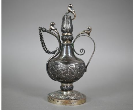 Description Amendment - An North Indian Mughal silver rosewater ewer surmounted by birds, with scroll handle and stopperd spo