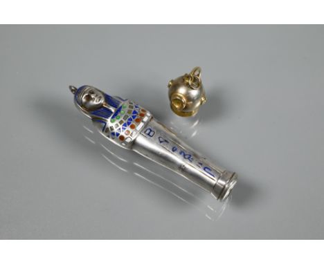 A 9ct divers helmet charm to/w a propelling pencil in the form of a sarcophagus, white metal with polychrome enamel decoratio