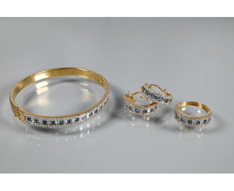 A diamond and blue topaz suite comprising half-hinged bangle with alternate channel-set diamonds and topaz to front c/w match