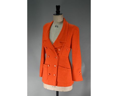 A Chanel Boutique fitted long-line jacket in orange boucle wool, double breasted with four pockets and a low double collar, o