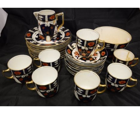 A Taylor & Kent of Longton Japan pattern part tea service and a brass warming pan