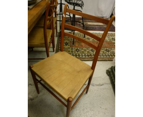 A set of six Swedish "Gemla" chairs with ladder backs over leather seats on turned legs united by stretchers
