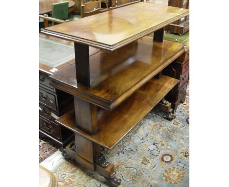 A Victorian three tier rise and fall buffet table of rectangular form with moulded edge, raised on rectangular end supports t