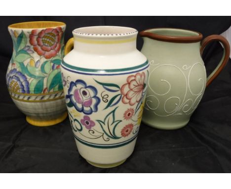 A Poole pottery floral decorated vase, a Crown Ducal floral decorated jug and a Denby jug