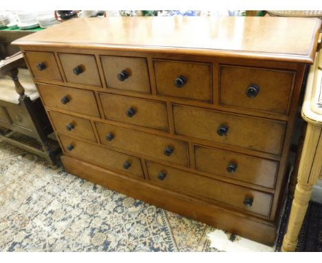 A burr oak and cross-banded chest in the 19th Century manner, the quartered top with moulded edge above thirteen various draw