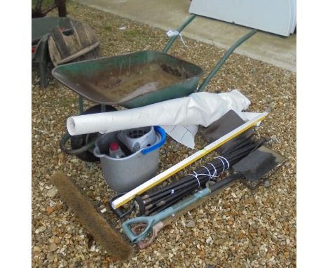 A metal wheelbarrow and collection of tools etc to include a set of drain rods, a spirit level, etc