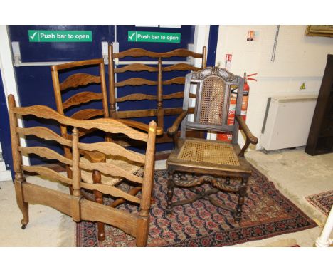 A 19th Century walnut carver chair with carved decoration and caned back and seat raised on an X stretcher, together with a 1