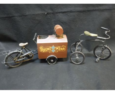A model tricycle and a model wine delivery bicycle unit with wine holder inscribed "Royal Wine" and "Wine for all season"