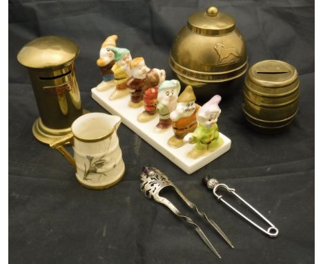 A Royal Worcester floral decorated miniature cream jug, a Clover Snow White and Seven Dwarves six section toast rack, a Lipto