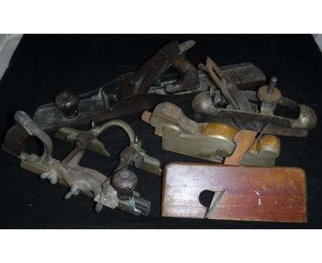 A collection of various wood-working tools including a Stanley No. 20 Compass plane, a Stanley No. 46 Skew Combination plane,
