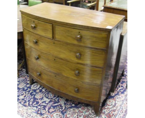 A Victorian mahogany bow fronted chest of drawers, the plain top above two short and three long graduated drawers, raised on 