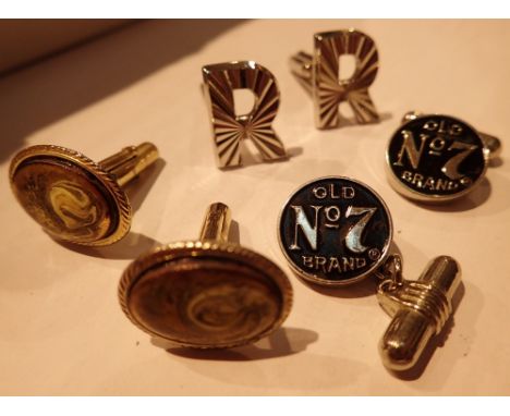 Three pairs of cufflinks including Jack Daniels