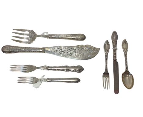 Pair of Victorian pierced and engraved silver fish servers, a Victorian patterned knife, fork and spoon set, a Victorian serv