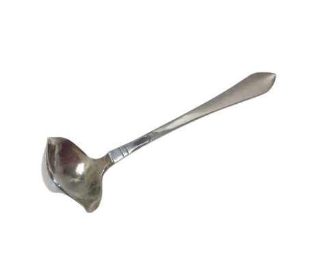 A Georg Jensen Danish silver double-lipped cream ladle with hammered bowl, Copenhagen mark for 1924, London import marks, 12.