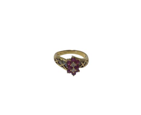 18ct gold ruby and diamond double flower head cluster ring, size N, 4.2g
