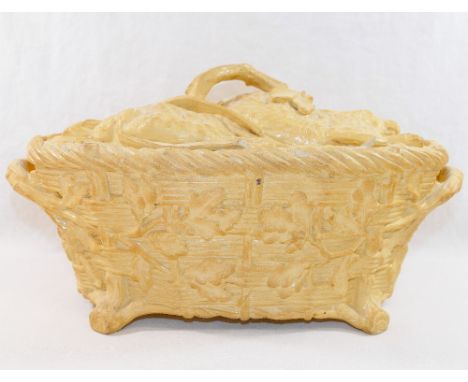 A 19th century Minton caneware tureen modelled in the form of a two-handed oval basket containing game, with date cipher for 