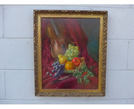 WILF WALKER (XX) An ornate gilt framed oil on canvas, still life of a Violin, fruit and Holly sprig. Signed bottom right. Ima