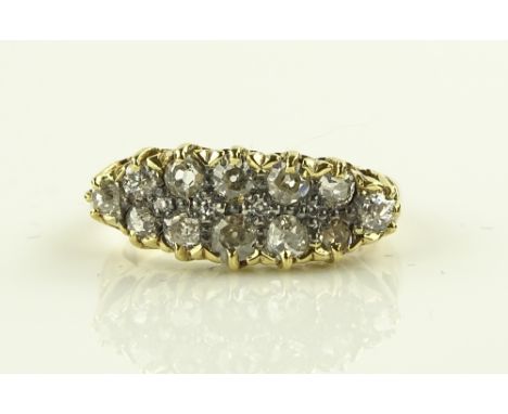 A 9ct gold diamond set ring, total diamond content approx. 0.6cts, setting width 20mm, size K.