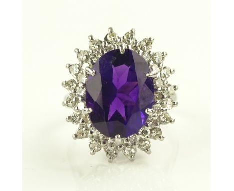 A large 18ct white gold amethyst and diamond cluster ring, setting height 20mm, size K.