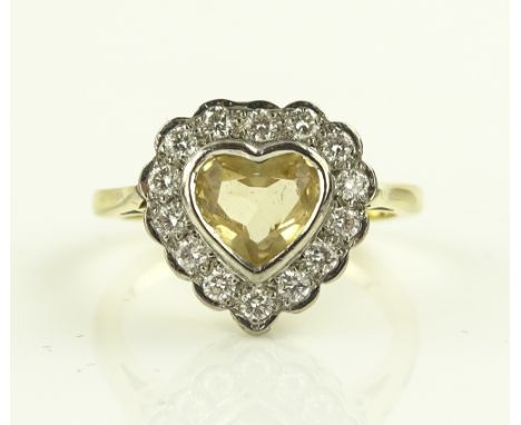 An 18ct gold citrine and diamond heart shaped cluster ring, setting height 13mm, size K.