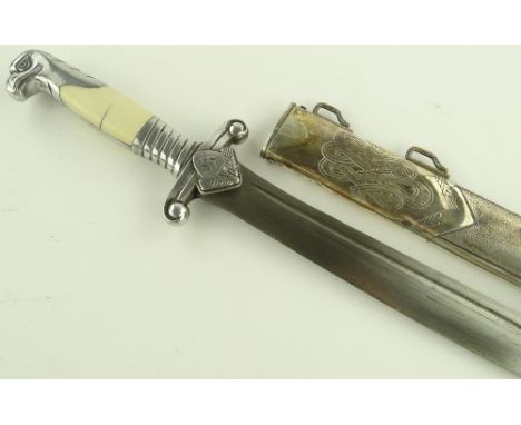 A German Third Reich RAD hewer dagger, nickel plate eagle head design hilt with composition grips, etched motto to the blade,