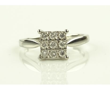 An 18ct white gold 0.25ct diamond panel, setting height 6mm, size K.