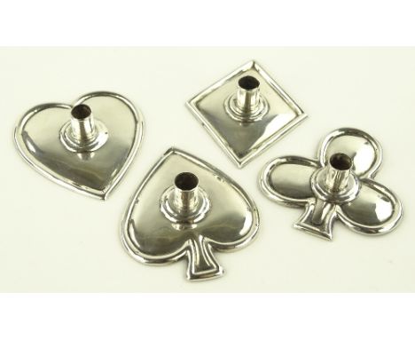 A set of 4 sterling silver playing card suit design miniature candlesticks, length 5cm.