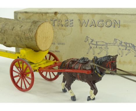 A Mettoy tinplate mechanical tractor and trailer, all in original condition, tractor length 19cm, boxed.