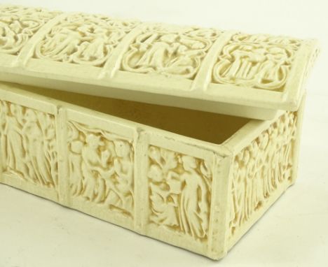 A Zsolnay white ceramic domed top box, relief classical decoration, length 37.5cm.